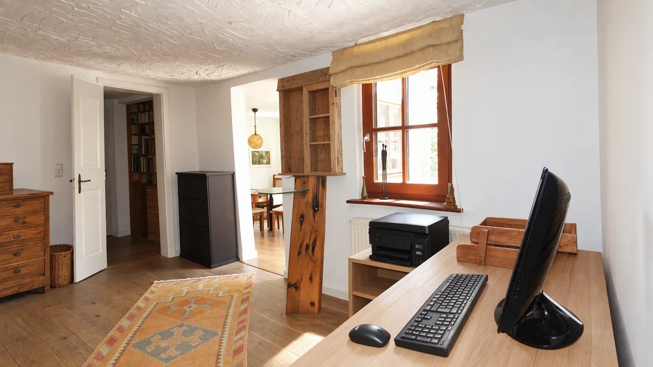 The same room tidied up, with clear surfaces and bare shelves